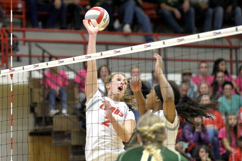 Senior setter Hannah Johnson watches a CSU spike go past at Johnson Center Saturday night. The Lobos lost to CSU 3-0.