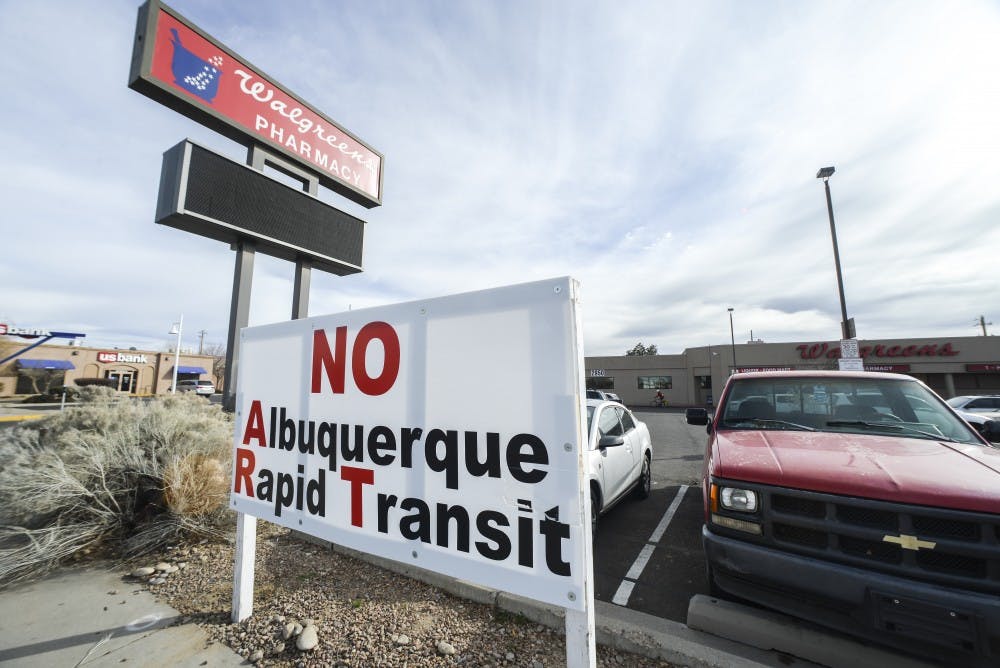 An anti-Albuquerque Rapid Transit sign sits in front of Walgreens on Central Avenue in February. The city will break ground on the project in August, about the same time that UNM will begin Johnson Gym renovations.&nbsp;