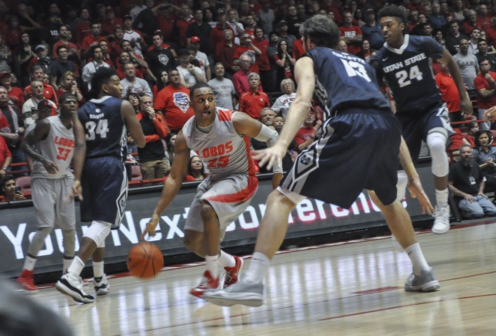 New Mexico junior guard Tim Jacobs looks for an opening during the Feb. 7 loss against Utah State University. The Lobos take on Mountain West leader SDSU tonight at 7:30 p.m. in WisePies Arena.