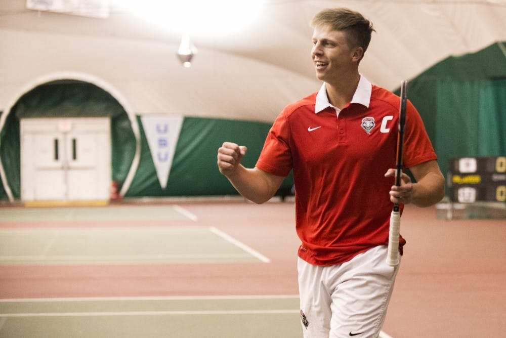 Junior Hayden Sabatka celebrates after winning a set Saturday afternoon. The Lobos played the University of Northern Arizona Monday afternoon, beating them 7-0.&nbsp;
