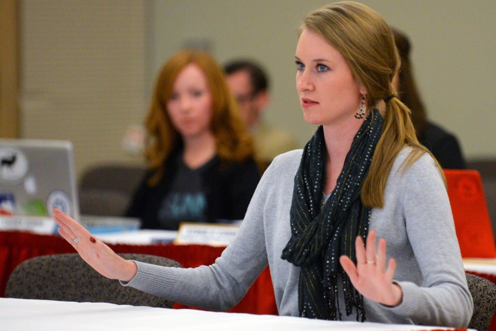 ASUNM president Jenna Hagengruber speaks at ASUNM's final fall 2015 senate meeting in the SUB Ballroom Wednesday night. A resolution was passed thanking LoboRESPECT for the work they have done to bring awareness about sexual assault on campus.&nbsp;