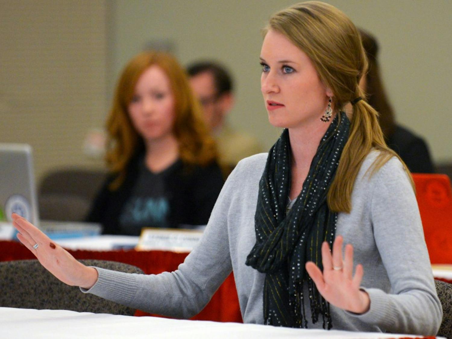 ASUNM president Jenna Hagengruber speaks at ASUNM's final fall 2015 senate meeting in the SUB Ballroom Wednesday night. A resolution was passed thanking LoboRESPECT for the work they have done to bring awareness about sexual assault on campus.&nbsp;