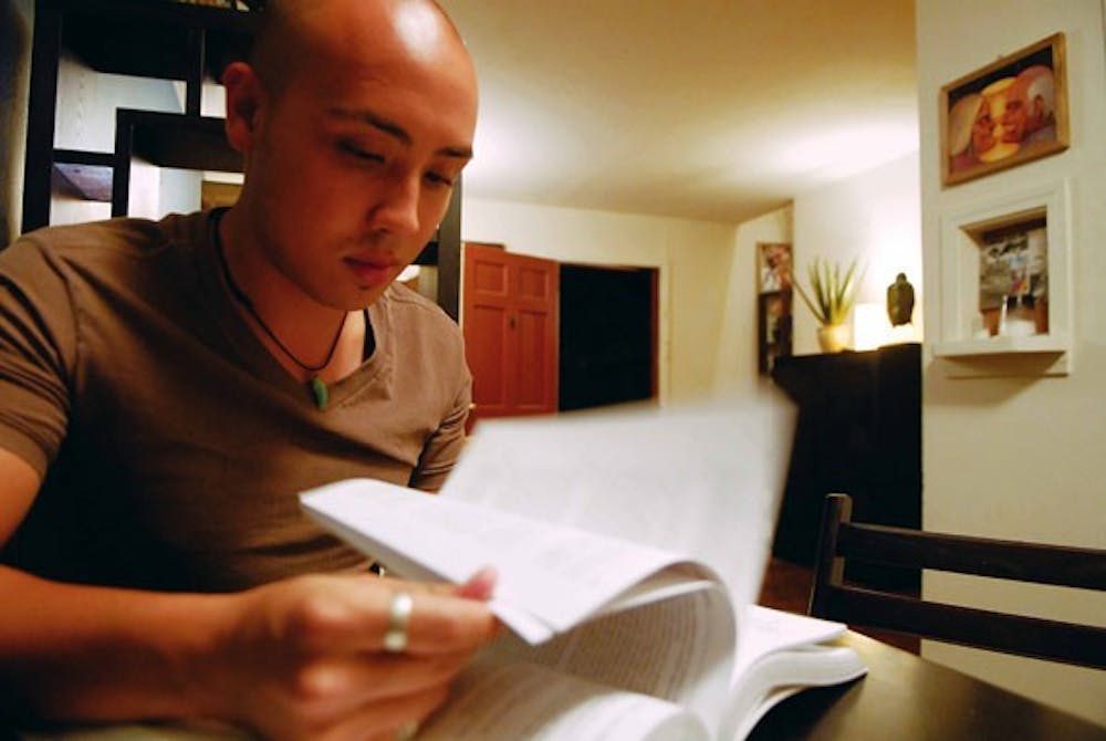 Senior Ryan Van Otten studies after work at his home Tuesday. 