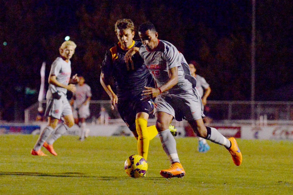 Lobo defender Yuri Domiciano protects the ball from a SFU player September 30. The Lobos lost to Old Dominion 0-2 and play VALPO Wednesday at UNM's Soccer Complex. 
