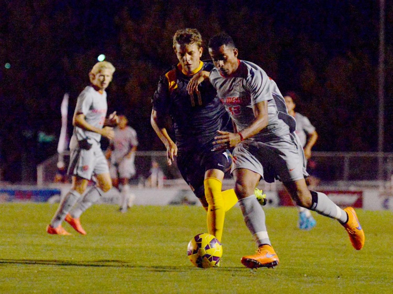 Lobo defender Yuri Domiciano protects the ball from a SFU player September 30. The Lobos lost to Old Dominion 0-2 and play VALPO Wednesday at UNM's Soccer Complex. 