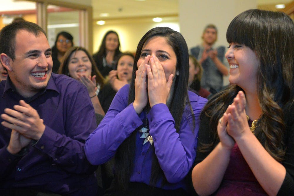 Incumbent Sen. Bisaan Hanouneh (purple) reacts to the announcement that she received the most votes as ASUNM senate election returns are revealed Wednesday evening at the SUB. More than 1,700 students selected 10 senators to hold office for the next two semesters.