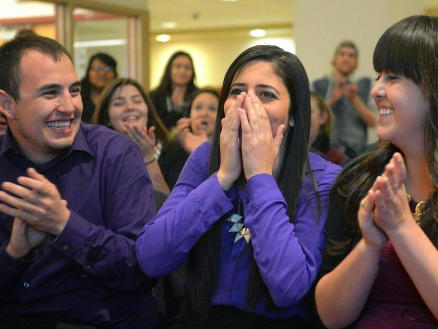 Incumbent Sen. Bisaan Hanouneh (purple) reacts to the announcement that she received the most votes as ASUNM senate election returns are revealed Wednesday evening at the SUB. More than 1,700 students selected 10 senators to hold office for the next two semesters.