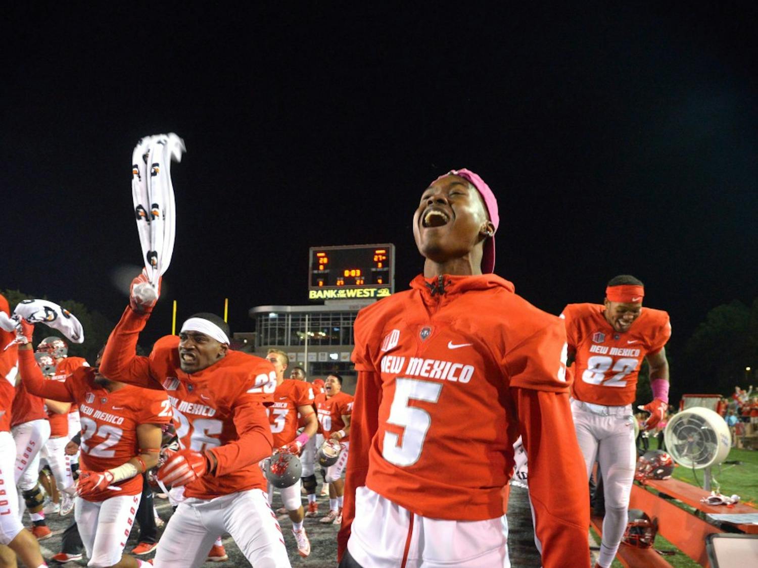 The Lobos celebrate moments before the end of their game against Hawaii University at University Stadium Oct. 17. The Lobos beat Boise State 31-24 this Saturday making them eligible for a bowl game and two victories away from entering the Mountain West Championships. 