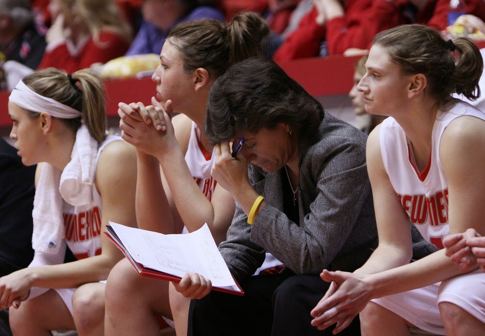 	Associate women’s basketball head coach, Yvonne Sanchez, buries her head in her hands during the second half of Wednesday’s game against UNLV. The Lobos lost 65-59. 