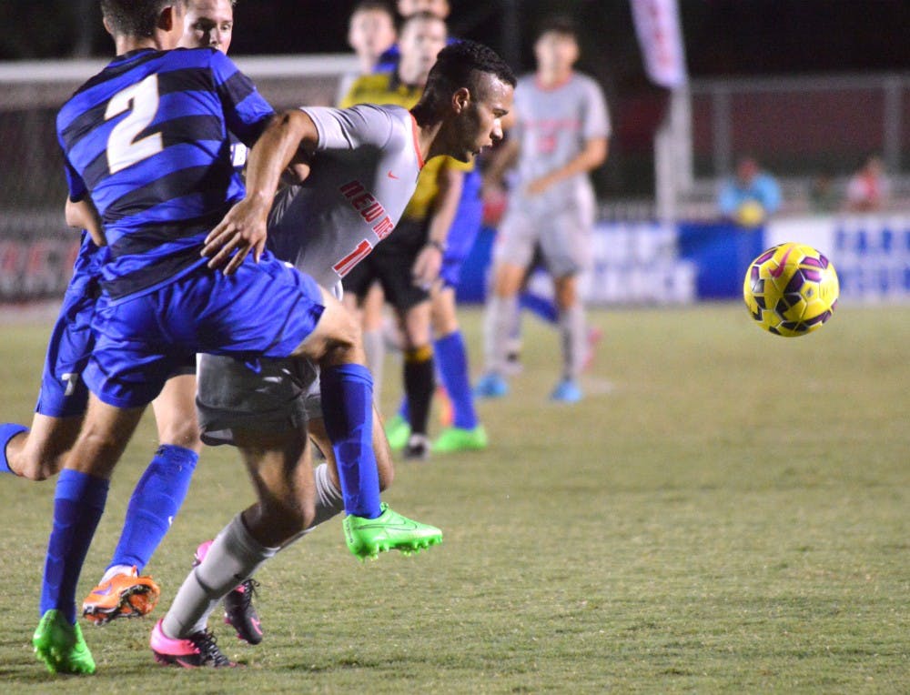 Niko Hansen charges past two San Diego players during their game on Sept. 4. The Lobos will play Missouri State this Friday at 7 p.m.
