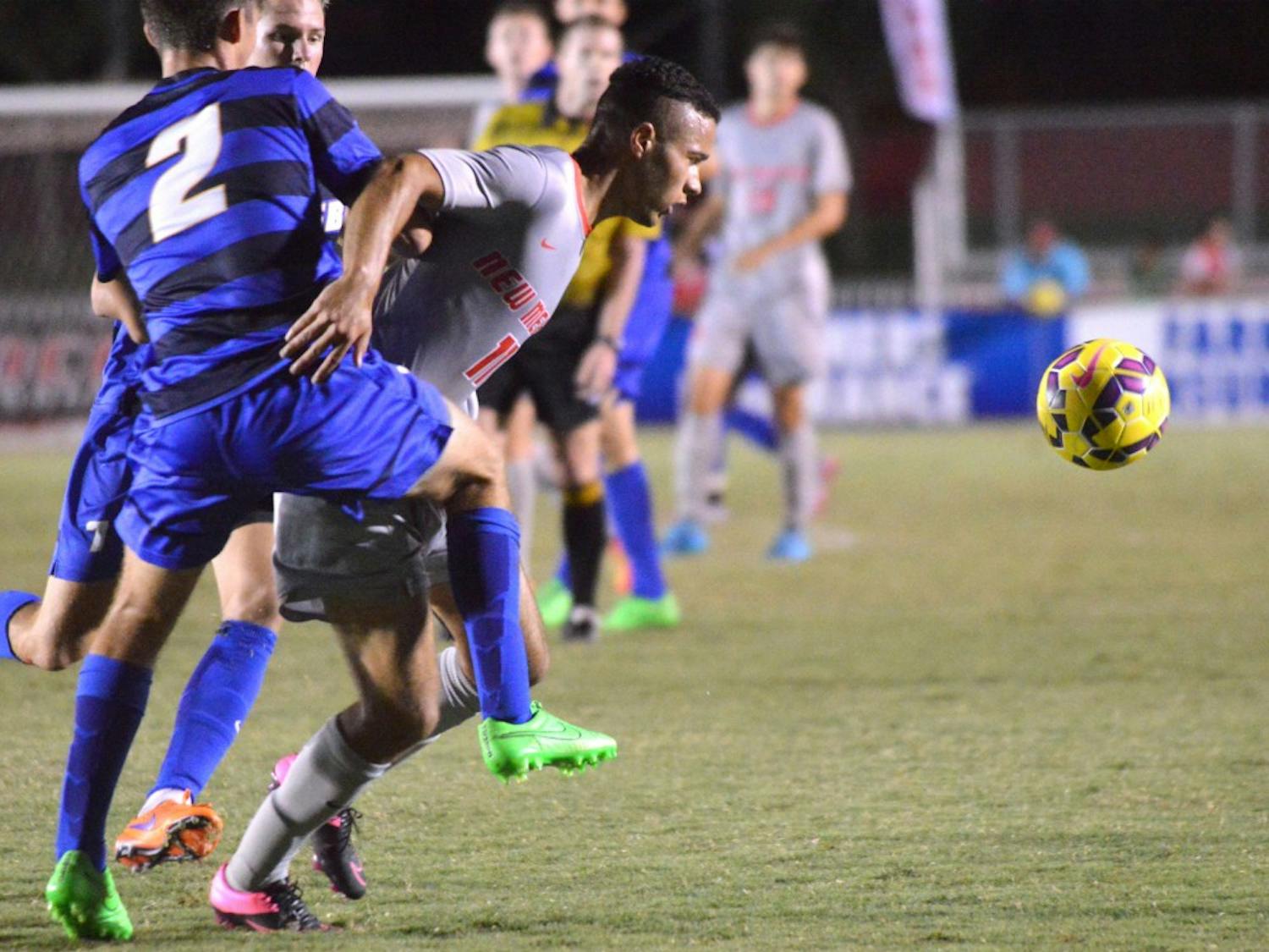 Niko Hansen charges past two San Diego players during their game on Sept. 4. The Lobos will play Missouri State this Friday at 7 p.m.