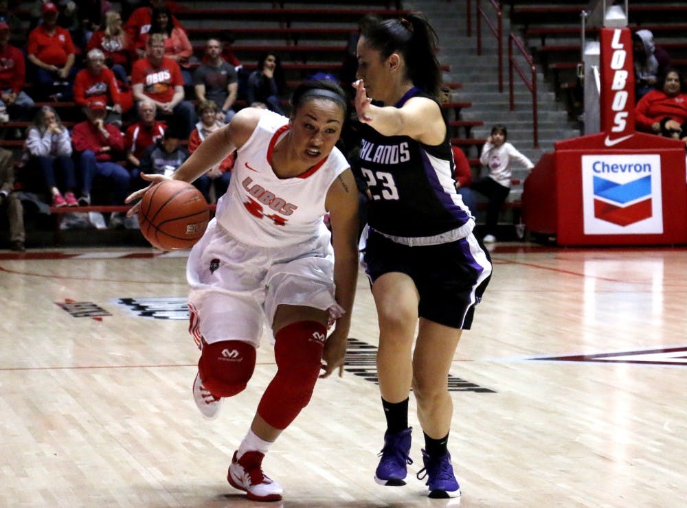 Sophomore guard Jayda Bovero dribbles past a New Mexico Highlands player at WisePies Arena on Nov. 7. The Lobos have their season opener against Houston Baptist this Friday at 8 p.m.