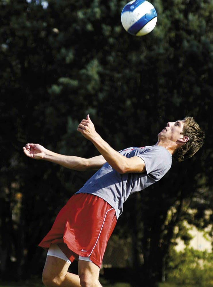 Former Lobo defender Andrew Boyens heads the ball during a practice Oct. 4 at the UNM Soccer Complex.