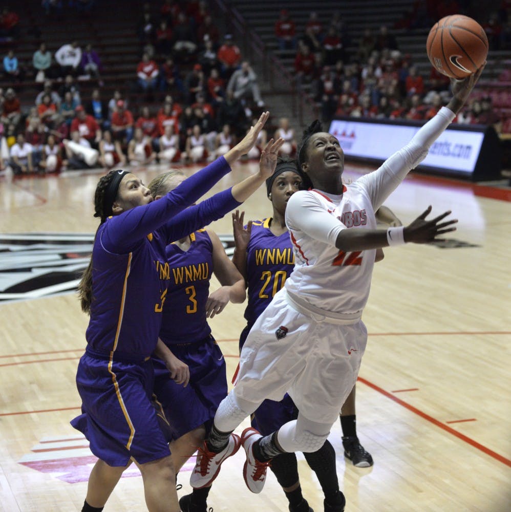 Senior guard Bryce Owens reaches out for a lay up at WisePies Arena Wednesday night. The Lobos beat Western New Mexico 78-41.&nbsp;