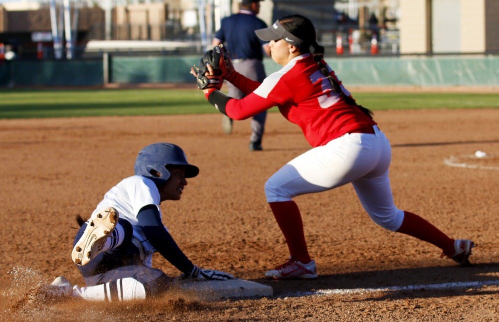 Junior infielder Jasmine Casados tries to tag out a Utah State player Saturday March 25, 2016 at the Lobo Softball Field. The&nbsp;Lobos lost two out of their three games against Nevada this past weekend.&nbsp;