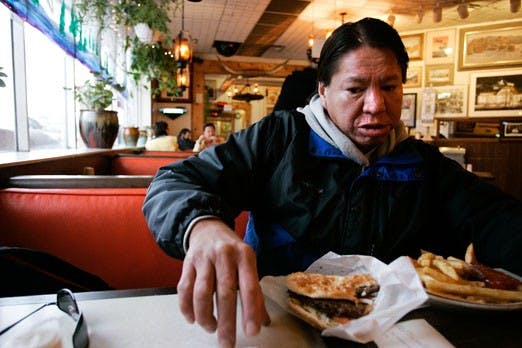 Wayne Longknife tells his story over dinner at the Frontier on Tuesday. 