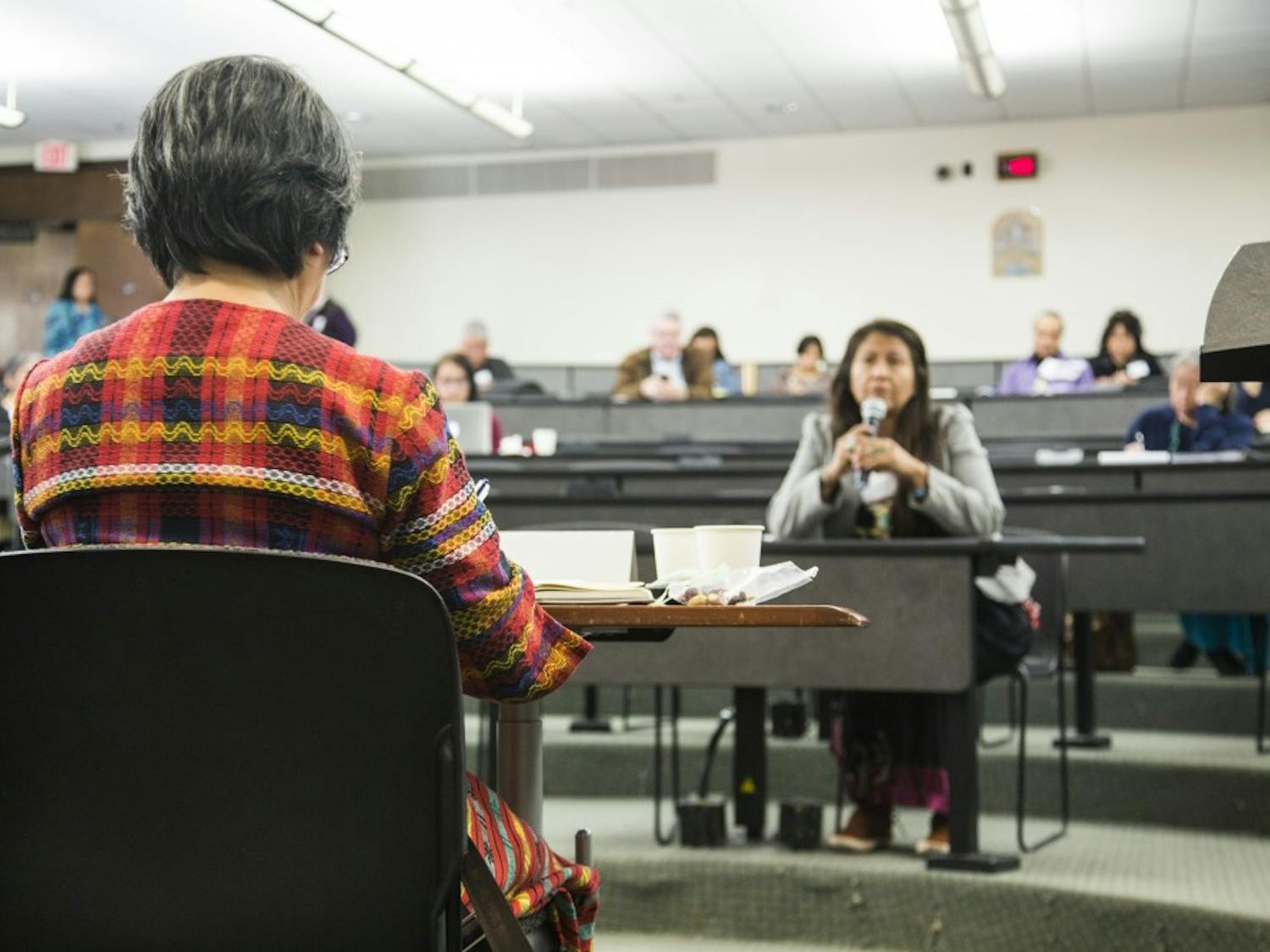 United Nations Special Rapporteur Victoria Tauli-Cortez listens to a woman who came to share her personal experiences at the Regional Indigenous Consultation hosted by the UNM School of Law on Saturday, Feb. 25, 2017. 