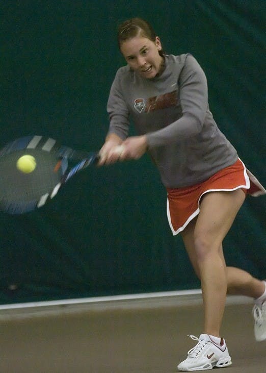 Sandra Zmak forehands a ball during a singles match in the Lobos 7-0 sweep of Idaho in the UNM Tennis Complex on Thursday.