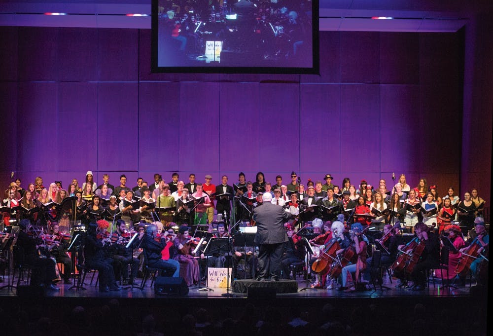 Byron Herrington conducts the New Mexico Philharmonic during Breaking Boo on Saturday Oct. 25, 2014 at Popejoy Hall. Attending Popejoy Hall events is one of the perks of being a UNM lobo. 