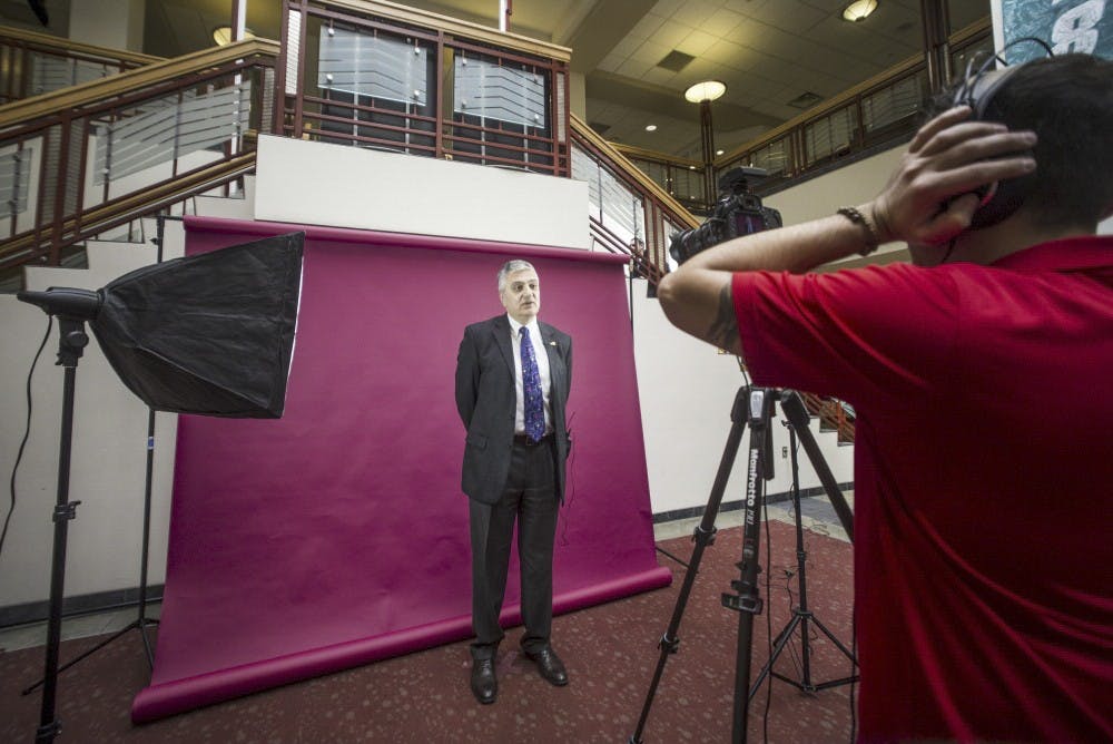 University President Chaouki Abdallah speaks in front of a camera as part of a project to promote international students on Feb. 8, 2017 in the UNM SUB Atrium.