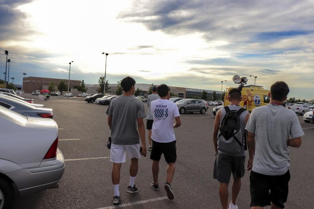 Members of the men's soccer team walk out of the Colleen J. Maloof Administration Building on Wednesday July 18, 2018, after being told that men's soccer was being recommended to be cut from UNM.