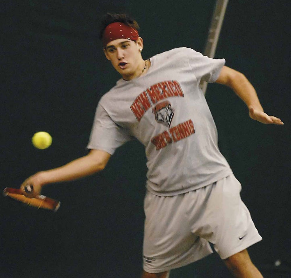 Johnny Parkes hits a forehand during practice Wednesday at the UNM Tennis Complex. 