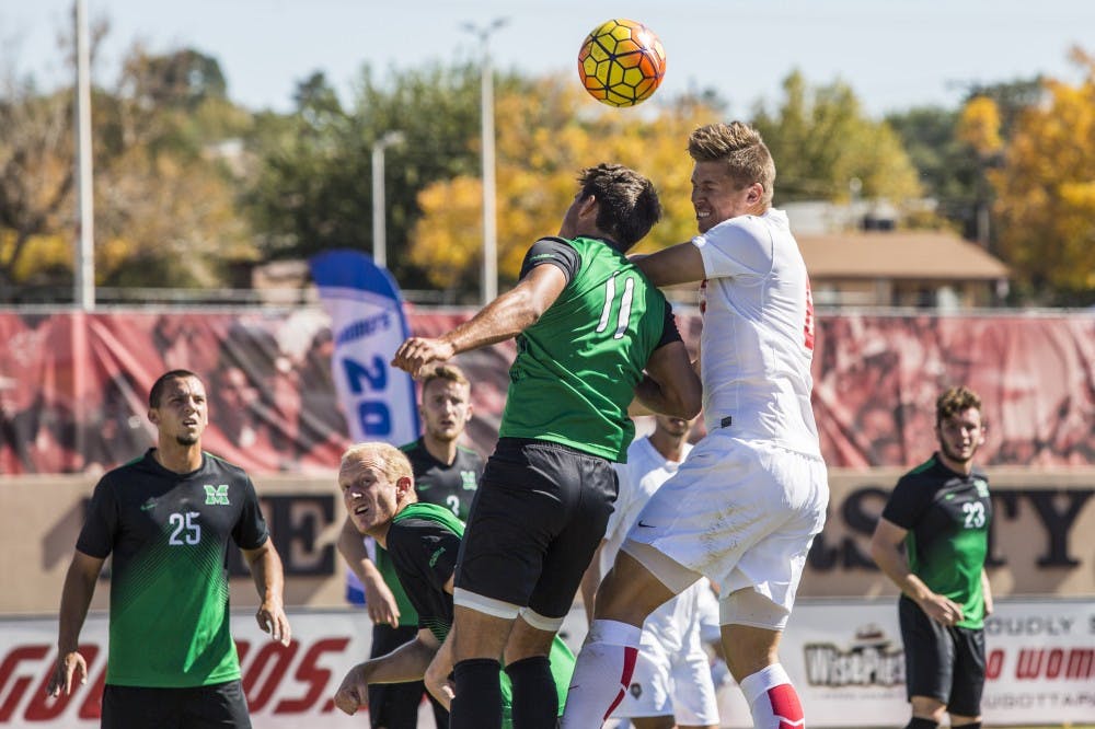 Redshirt senior Nick Rochowski clashes with a Marshall player during their game at the UNM Soccer Complex Saturday, Oct. 22, 2016.&nbsp;