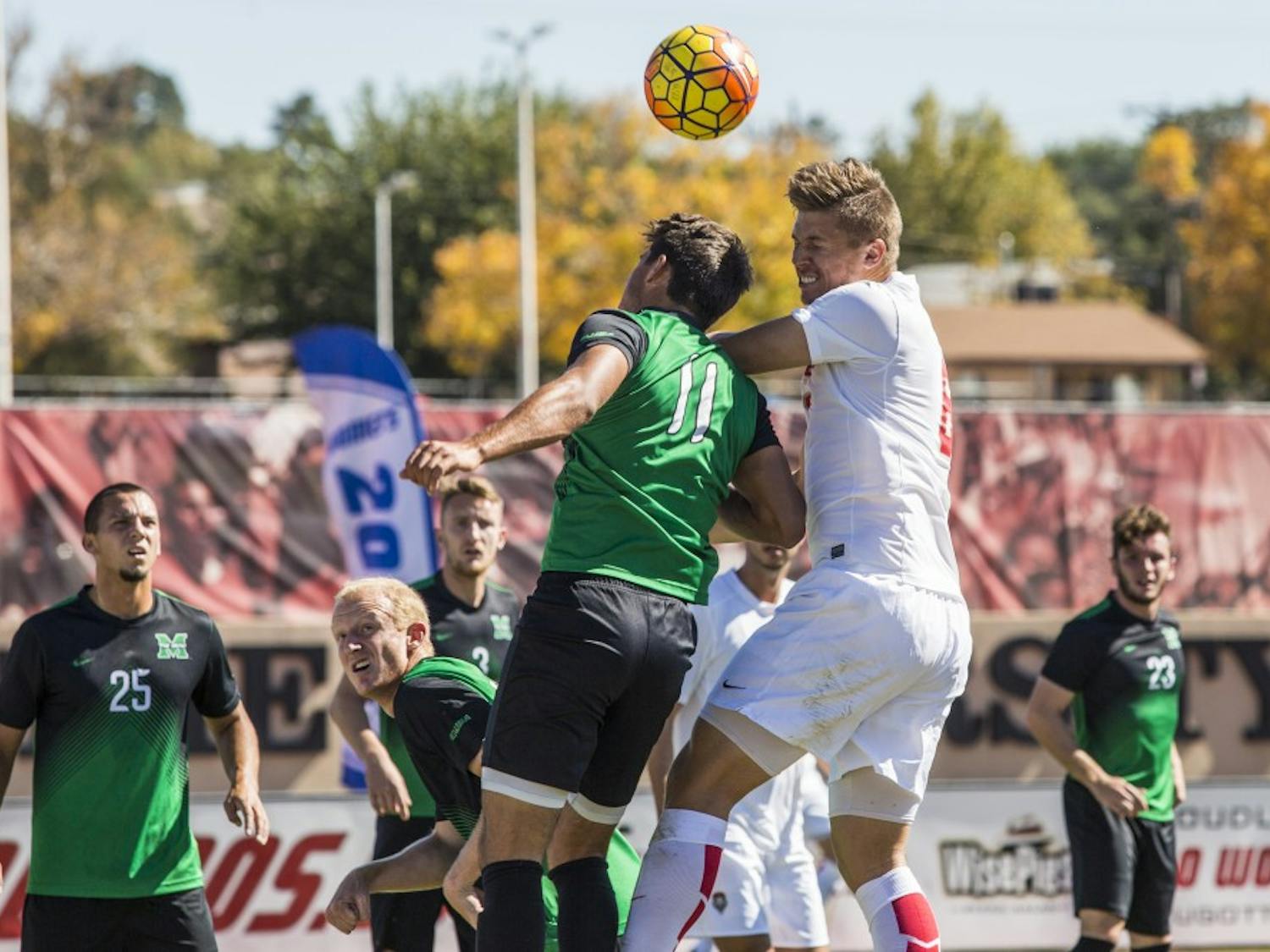 Redshirt senior Nick Rochowski clashes with a Marshall player during their game at the UNM Soccer Complex Saturday, Oct. 22, 2016.&nbsp;