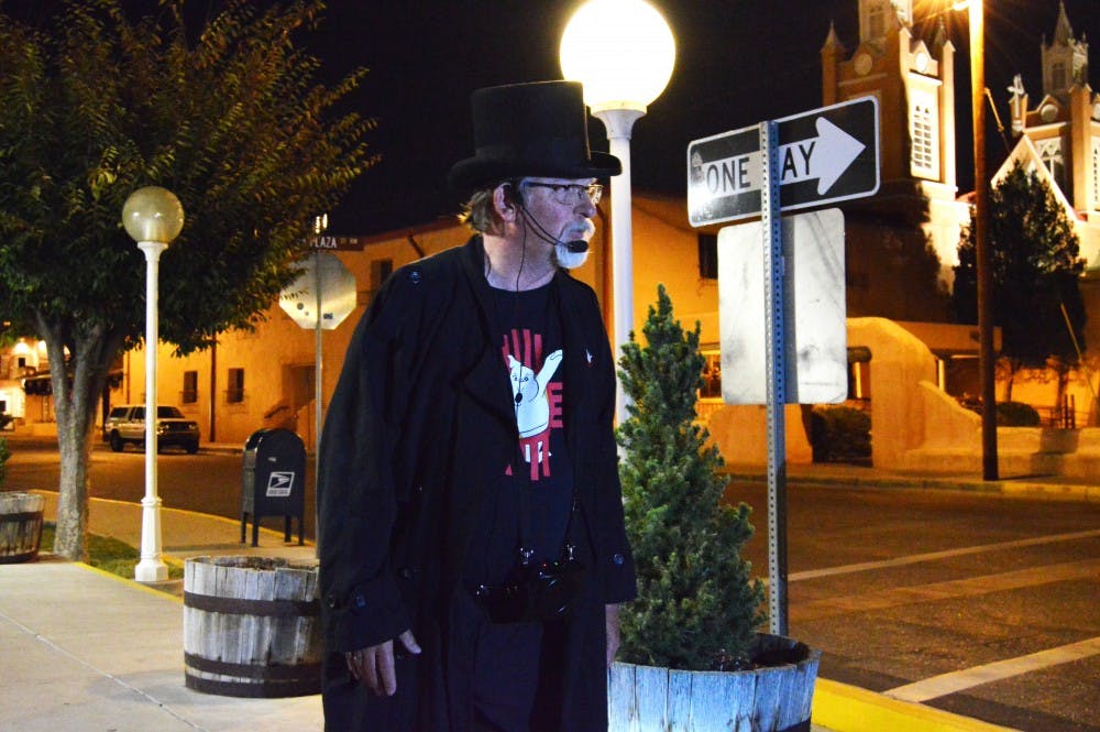 Craig Degenhardt retells a story during a ghost tour through Old Town Albuquerque Friday, Oct. 16, 2015. The 90 minute lantern lit tour takes attendees through 306 years of Old Town history and folklore.