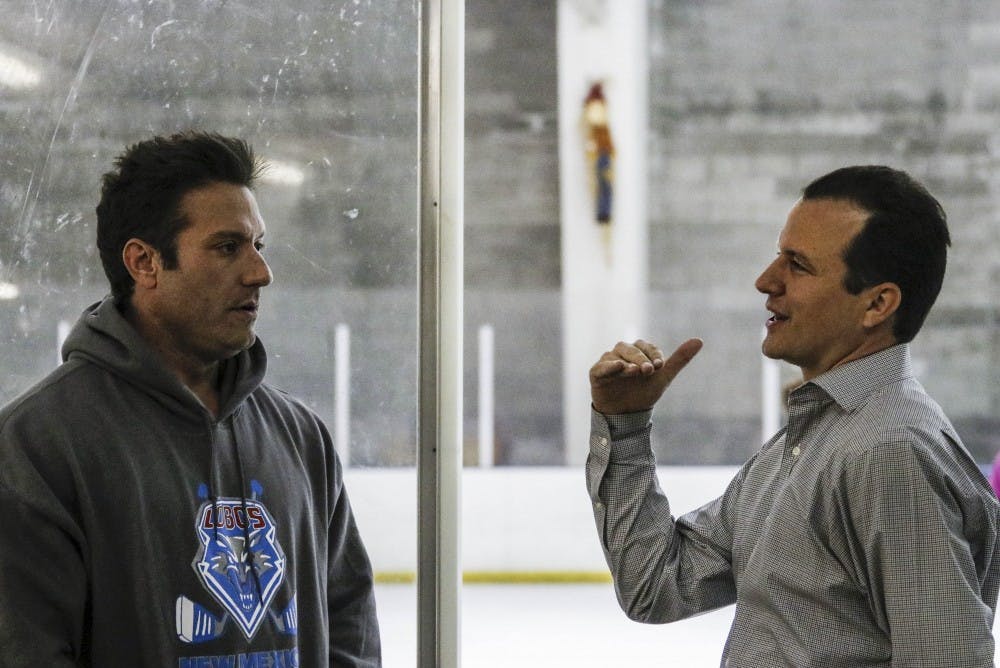 UNM Men?s hockey coach Grant Harvey, left, talks with UNM head men?s basketball coach Paul Weir during the men?s hockey practice on Aug. 30, 2017. Weir is a self-proclaimed hockey enthusiast.