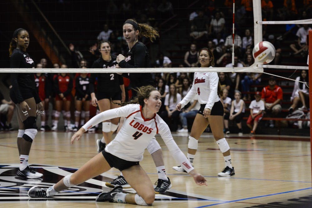 Sophomore setter Carson Heilborn dives to save a out of bounds ball Saturday, Sept. 10, 2016 at WisePies Arena aka the Pit.
