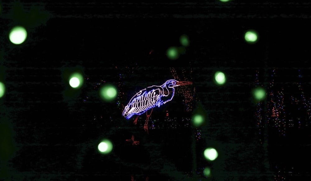 A crane made out of lights illuminates the surrounding area during the 2017 River of Lights on Dec. 08, 2017.