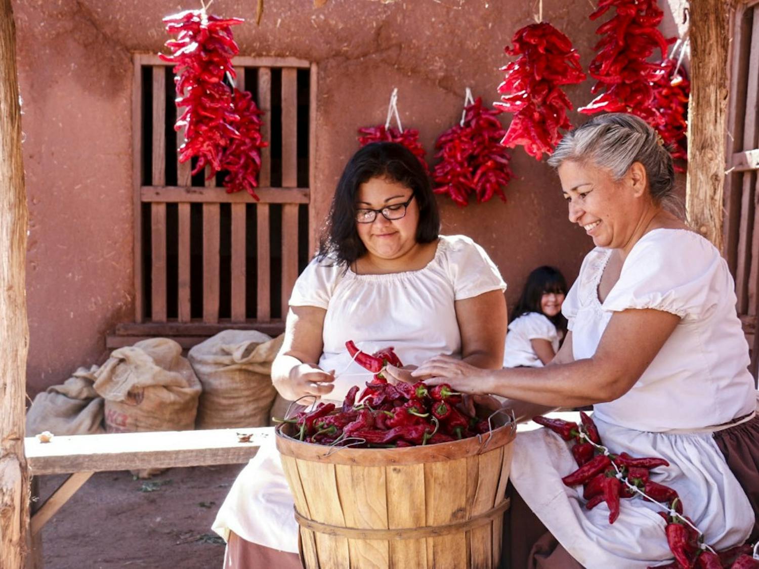 Chile ristra crafters show visitors how to create them at this year?s 45th Annual Harvest Festival at El Rancho de Las Golondrinas on Oct. 1, 2017. Las Golondrinas had ?villages? set throughout the ranch to demonstrate life during the 18th and 19th centuries.