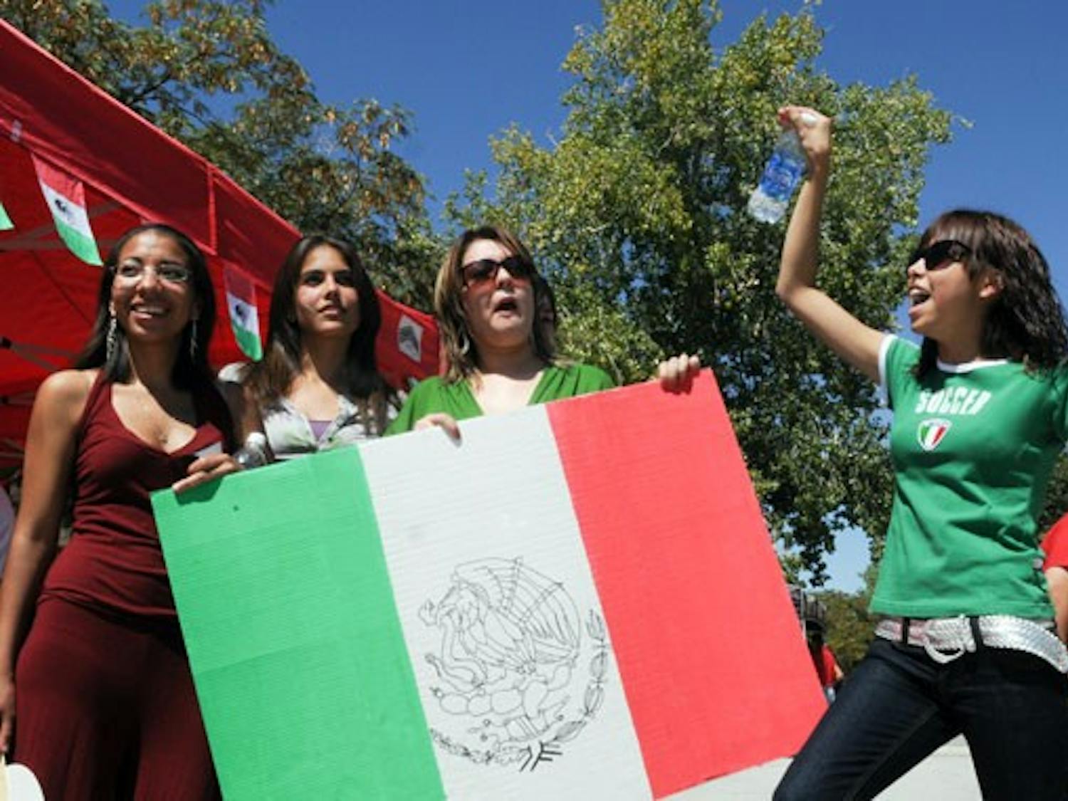 Members of the Mexican Student Association celebrate Mexican Independence Day on Tuesday near the SUB. The event included a flag raising.