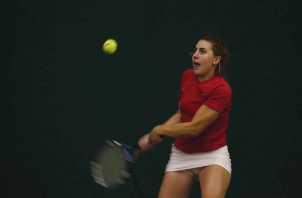 UNM's Mackenzie White returns a serve during her 7-6, 6-3 win over Colorado State's Hilary Tyler on Thursday at the UNM Tennis Complex.