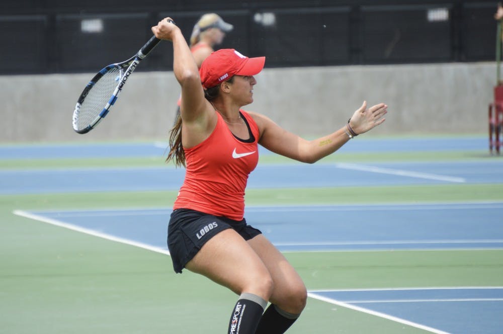 Junior Ludivine Burguiere sends the ball back during a match April 24, 2016 at the McKinnon Family Tennis Stadium.