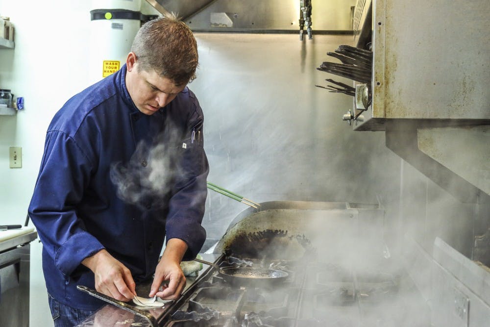 Head Chef Daniel John preps for Sunday night's dinner service at Torinos' @ Home. John has been the head chef at the Italian eatery&nbsp;for eight months, after he and his wife, Jenna John, took over the restaurant.