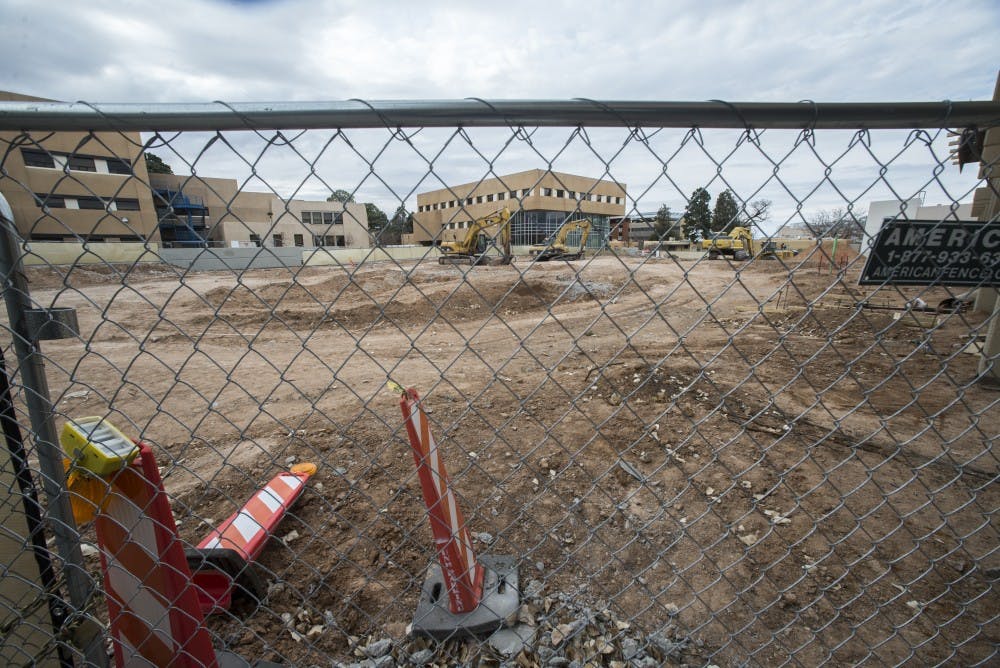 Construction equipment stands in place of a former section of the Anderson School of Management on Sunday, Feb. 12, 2017. The new McKinnon Center for Management is under construction  and has a projected finish date of March 2018.