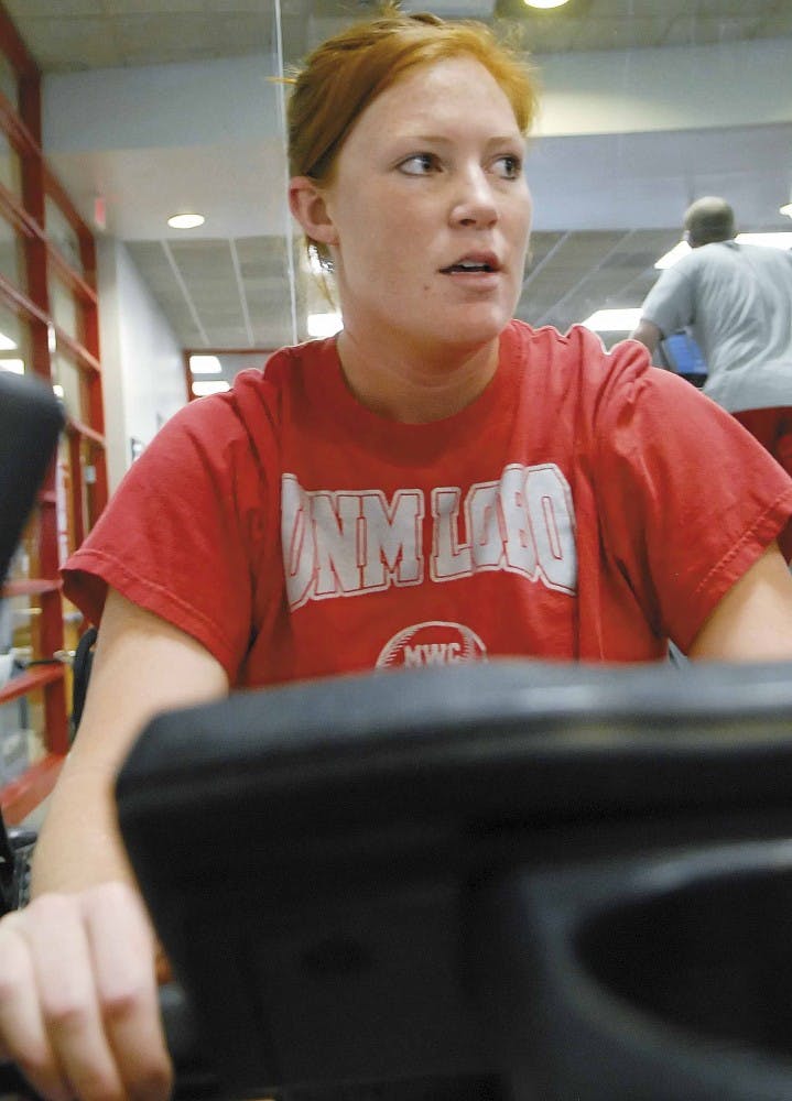 Junior pitcher Kelly Ninemire trains on a stationary bicycle at the Tow Diehm Athletic Complex 