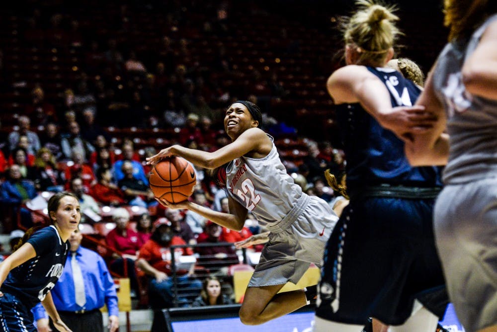 Freshman guard Mykiel Burleson jumps past Fort Lewis players on her way to the net Tuesday, Nov. 1, 2016 at WisePies Arena. The Lobos dominated Fort Lewis in their first exhibition match 101-48.