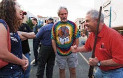 State Senator Shannon Robinson of Bernalillo County, right, tells a story to Alexis Kerschner, left, and Brad Stoddard early Saturday morning Downtown. Robinson was asked to fire a shotgun to signal the start of the Duke City Shootout filmmaking competiti