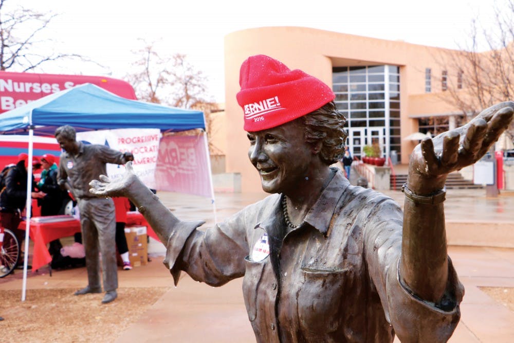 A pro-Bernie Sanders hat adorns a statue near the SUB. Supporters of the democratic presidential candidate gathered to give out free hats, pins and stickers to students on Tuesday.