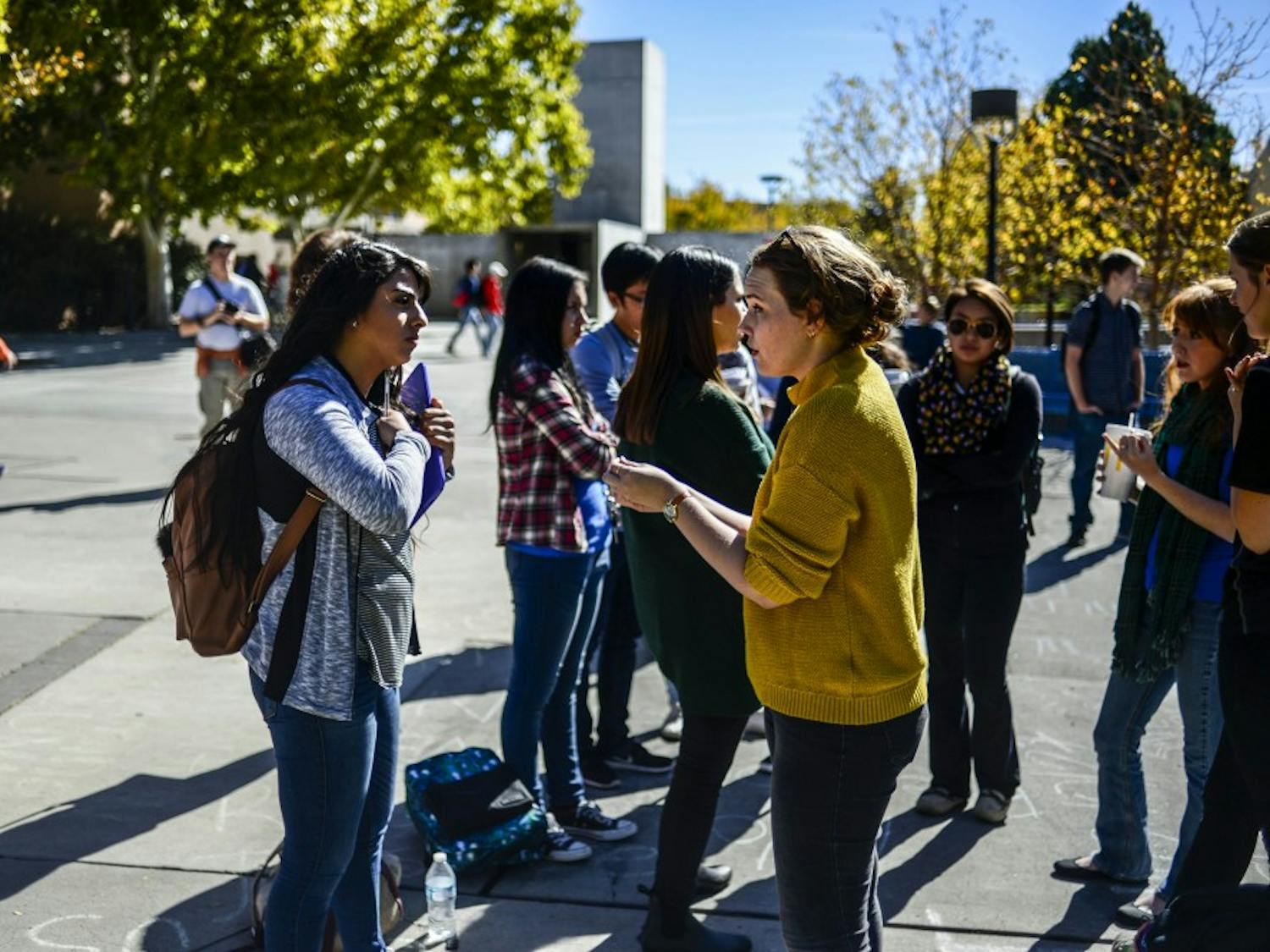 Raneen Khweis, UNM junior (left), and Grace Fontenot of the group Justice for All discuss women?s rights and the legality of abortion at a Students for Life of America event near the Duck Pond on Oct. 24, 2017 as part of UNM?s annual Sex Week. 