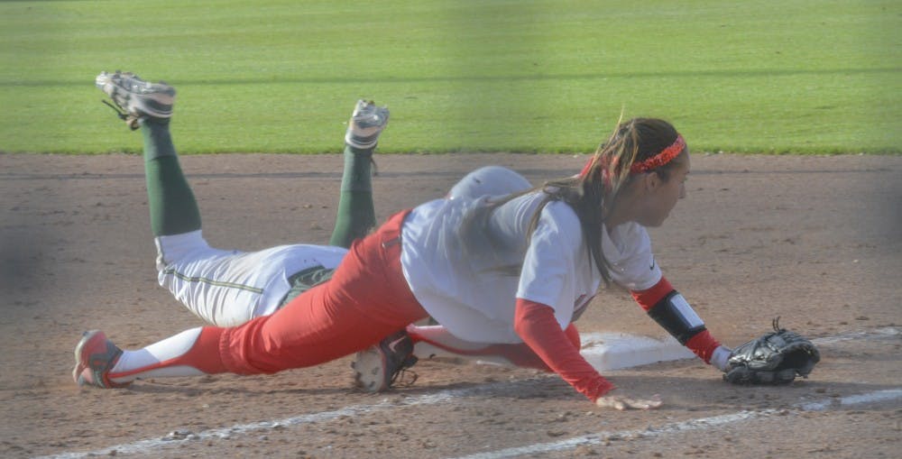 UNM infielder Karissa Haleman misses the ball to take out the Colorado player at Lobo field Saturday. The Lobos won the series. 