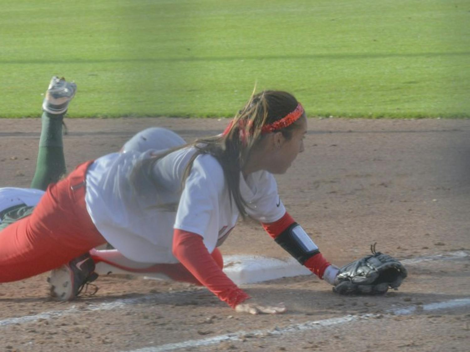 UNM infielder Karissa Haleman misses the ball to take out the Colorado player at Lobo field Saturday. The Lobos won the series. 
