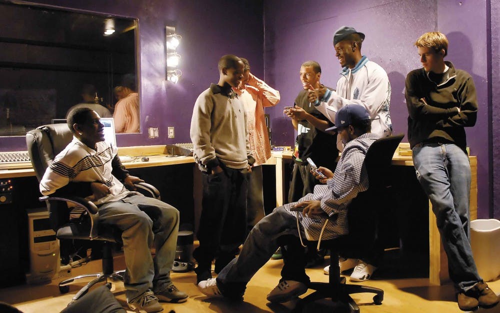 Members of Royalty Life Records talk in their studio on 1724 Archuleta Drive on Tuesday. 