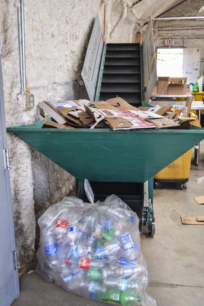 Plastic bottles and cardboard sit separated at UNM’s recycling facility. The University is the state's second largest recycler of materials such as plastics, metals and batteries.