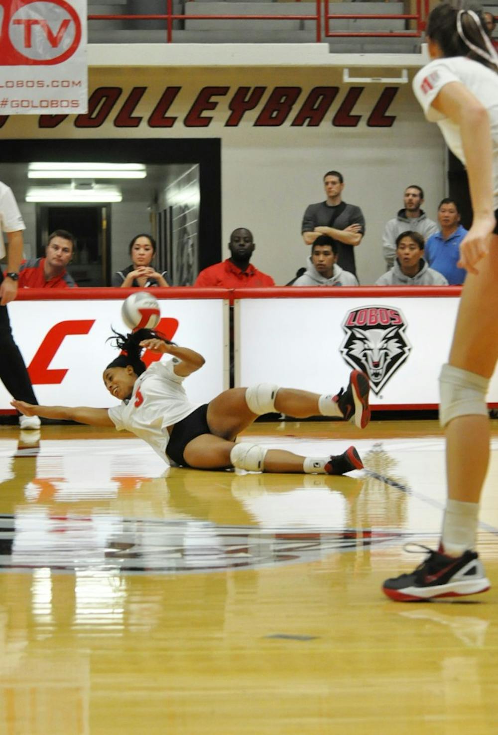 Lobo right side hitter Chantale Riddle dives to the save the ball on Oct. 23 against Nevada. The Lobos won 3-1, breaking the four game losing streak.