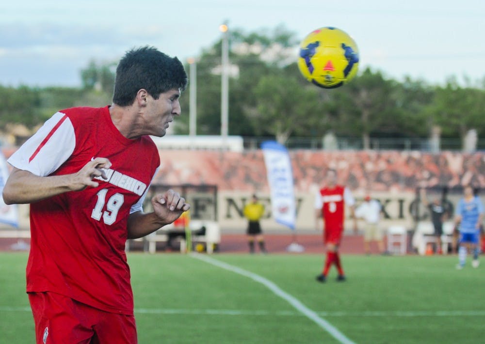 	UNM redshirt junior midfielder Josh Dye makes a play on the ball during the men’s soccer exhibition game against Fort Lewis on Monday evening. The Lobos defeated Fort Lewis 3-0.