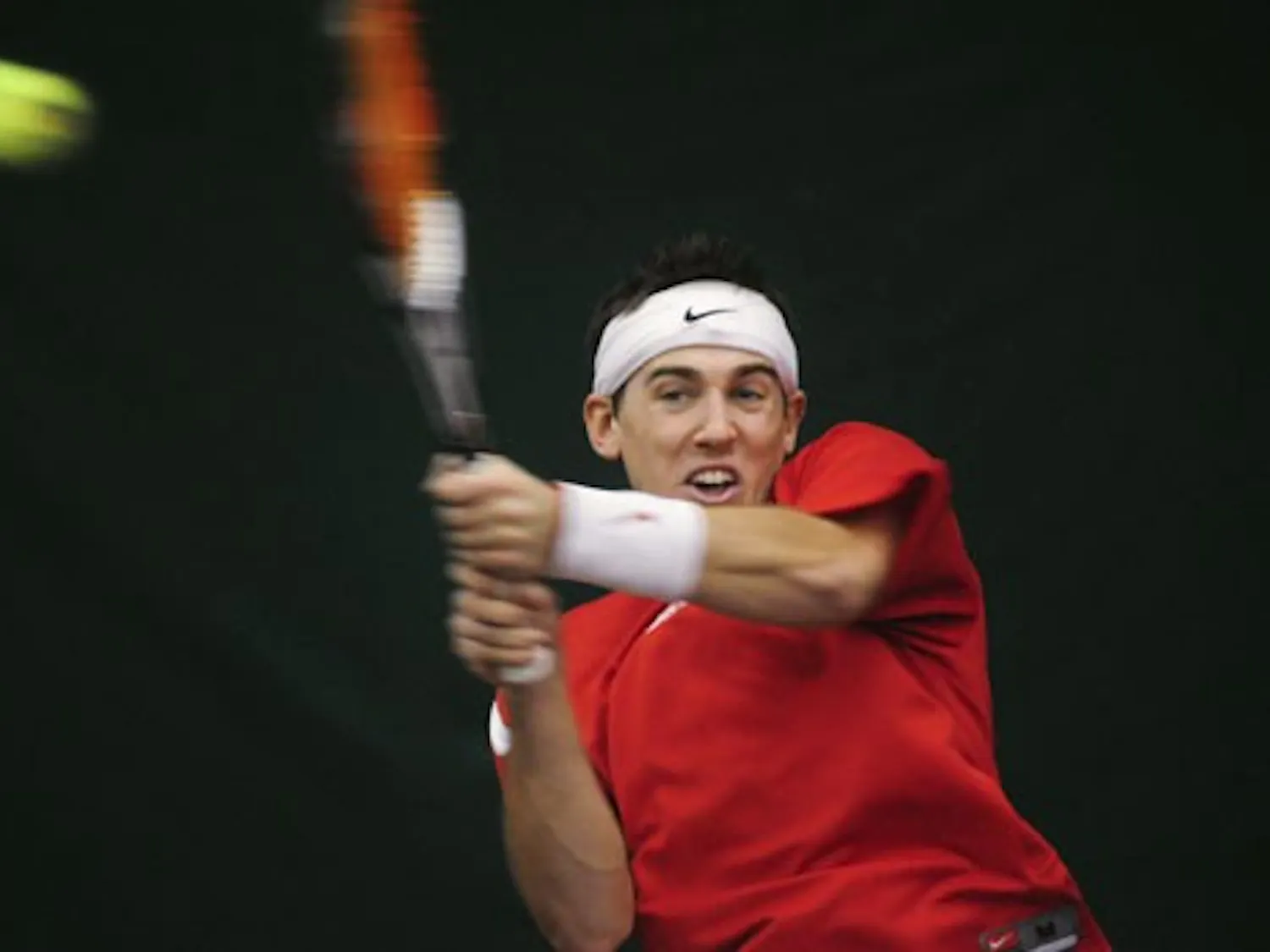 Graeme Kassautzki returns a volley Sunday during the Lobos' win over Indiana. UNM has a chance to play the No. 1 team in the country on Sunday.